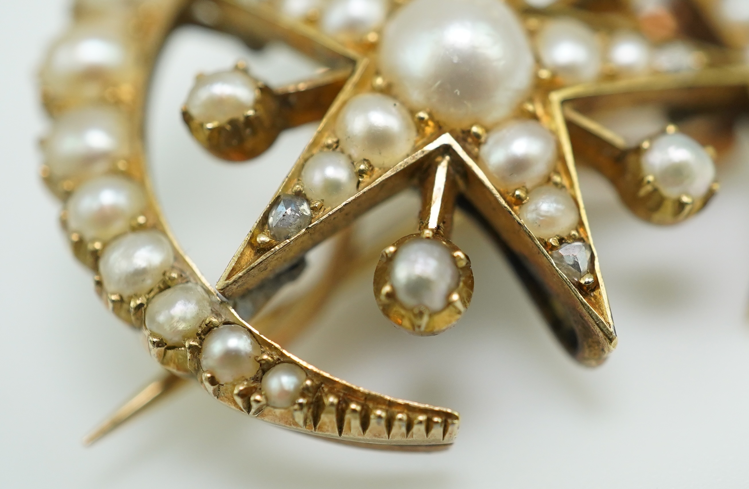 An Edwardian half pearl and diamond brooch, early 20th century